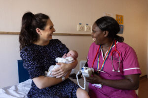 Mum and baby with a nurse