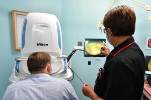 patient and technician using equipment
